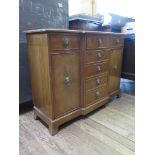 A reproduction mahogany breakfront side cabinet, the three frieze drawers over a dummy drawer