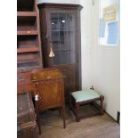 An oak corner cabinet, with lead glazed door, above a panelled door, a bedside cupboard and a