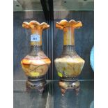 A pair of Oriental stained alabaster and brass vases, with wavy edge rims, 23cm high