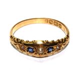 A five stone sapphire and pearl ring set in 18 carat gold