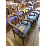 A set of four Victorian mahogany balloon back dining chairs, including two armchairs on turned