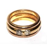 An 18 carat gold ring set with two old cut diamonds