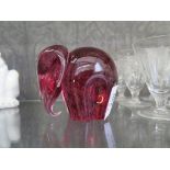 A Wedgwood speckled pink glass elephant paperweight, 9cm high