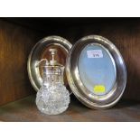 A pair of silver plated oval photo frames together with silver plated cut glass scent spray