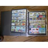 An album of fish and reptile themed international postage stamps