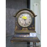 A 1920s blue lacquer mantel timepiece clock, with relief chinoserie decoration and silvered dial,