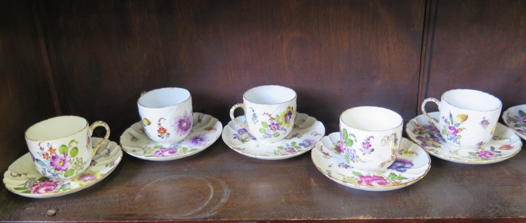 A set of ten German porcelain cup and saucers, each with painted floral decoration, 7.5cm high, tied - Image 3 of 4