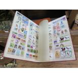 Two stock book albums of bird themed World postage stamps