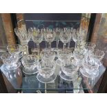 A set of eleven Waterford crystal wine glasses, with faceted bowls and stems, 19cm high, and eleven