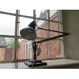 A black metal 'Anglepoise' lamp by Herbert Terry & Sons