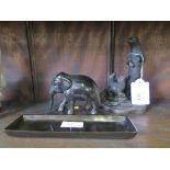 A bronze desk tray with elephant together with a bronze finish otter family sculpture, signed
