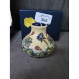 A Moorcroft Pottery meadow design miniature vase dated '99, 5cm high, with box