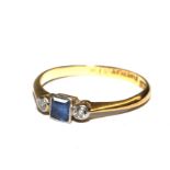 An 18 carat gold diamond and sapphire three stone ring