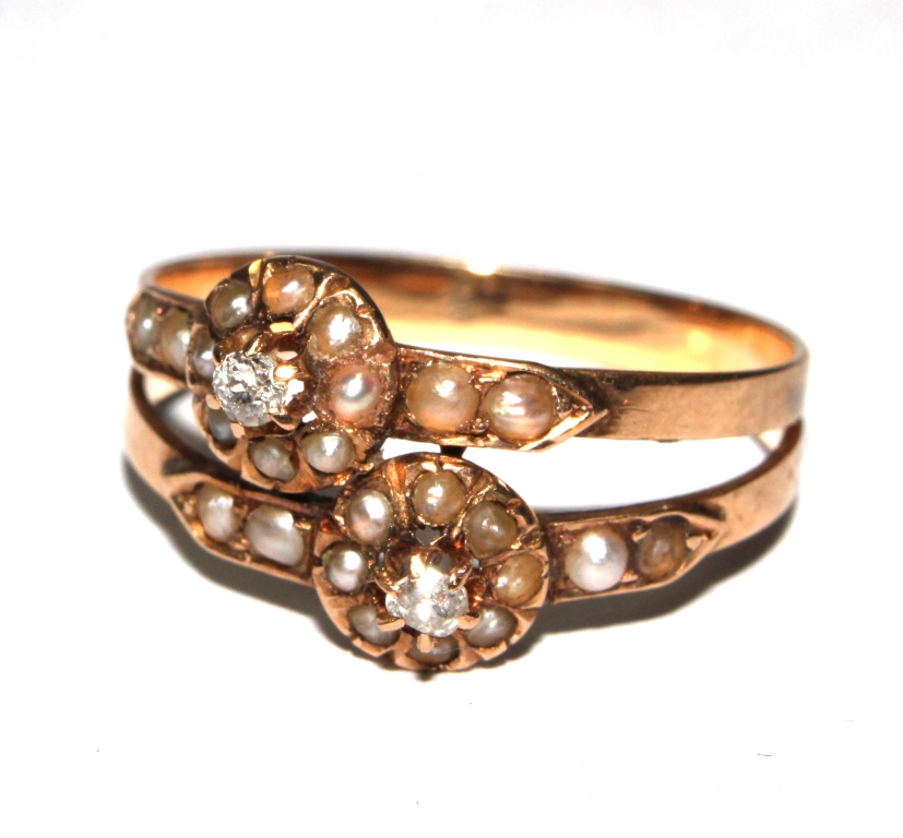 A posy seed pearl and diamond cross over ring