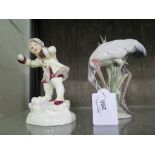 A Royal Worcester figure 'December 3458' modelled by FG Doughty 16cm high and a Lladro figure of a