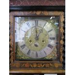 A walnut and marquetry longcase clock, the fret carved cornice over a brass dial with cherub