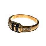 A 14 carat gold ring set to the centre with square sapphires and diamond set to the shoulders