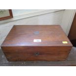 A 19th century rosewood writing box of rectangular form with sloping fitted interior 25cm wide, 22.