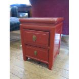 A Chinese red stained side cabinet, with two drawers 35cm square, 46cm high