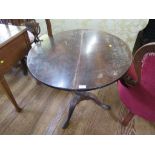 A mahogany tripod table, George III parts, the circular snaptop on a baluster stem and cabriole legs