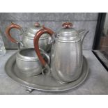 A four piece pewter tea set on tray