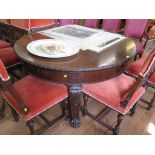 An Edwardian mahogany extending dining table, the top with rounded ends, gadrooned edge and blind