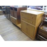 An 1950s oak dressing table and side cabinet by Meredew Furniture, the dressing table with long