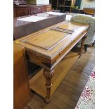 A Fench style light walnut side table, the panelled and carved top over turned tapering legs