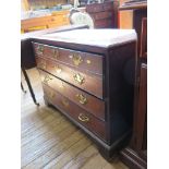 A George III mahogany and boxwood banded chest, with one deep and two long drawers on bracket