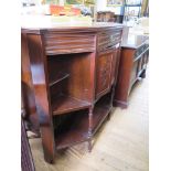 An Edwardian walnut and stained beech canted side cabinet, with frieze drawer over floral carved