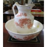 An Edwardian wash bowl and jug, printed with floral sprays