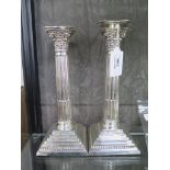 A pair of silver Corinthian column candlesticks, 25cm high, Birmingham 1901