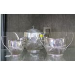 A three piece silver tea set with ribbed decoration, Sheffield 1887