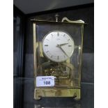 A Schatz brass lantern form electric timepiece clock, the silvered dial with baton chapters 22cm