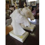 A pair of white alabaster figures of horses heads, with brass finials , 36cm high