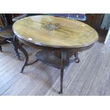 An Edwardian inlaid rosewood centre table, the oval top on square cabriole legs joined by undershelf