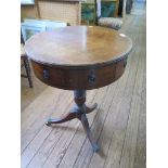 A small 19th century mahogany drum table, the circular top with four drawers and dummy drawers on