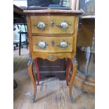 A French style mahogany serpentine bedside table, with two drawers and square cabriole legs with