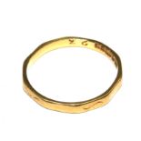An 18 carat gold wedding ring