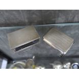 A silver match book holder together with a silver match box holder