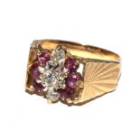 A diamond and coloured stone ring set in 9 carat gold