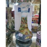 A Cobridge Stoneware vase depicting an autumnal lake scene, marked trial 7.8.99 and signed by Nicola