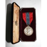 A cased Imperial Service Medal