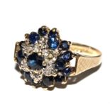 A sapphire and diamond cluster ring set in 9 carat gold