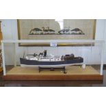 A scale model of a Naval patrol vessel, in a perspex case, 45cm long