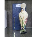 A Moorcroft Pottery 'Grasshopper' vase, designed and signed by Phil Richardson, with box, 2011, 21cm