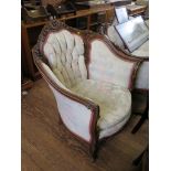 A French style three seat button back settee, with floral carving and cabriole legs, 195cm wide, and