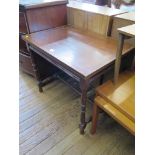 A late Victorian chevron banded mahogany table, the rectangular top on turned supports and