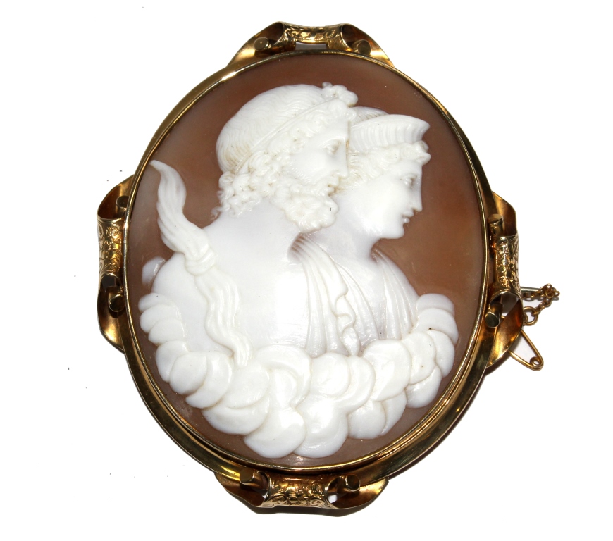 A large shell cameo depicting a Greek lady and gentleman, on gold colour frame