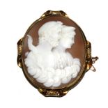 A large shell cameo depicting a Greek lady and gentleman, on gold colour frame